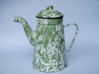 An elegant vintage-inspired green enamel teapot featuring a marbled design, displayed against a solid light background, showcasing its artistic and functional design, perfect for kitchens or vintage-t