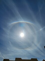 Doouble sundog in bright blue daytime sky