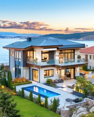 Fototapeta premium Modern Luxury House with Pool and Scenic Landscape at Sunset