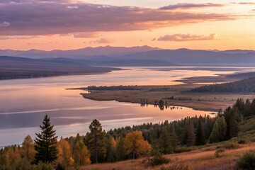 Fototapeta premium Serene Sunset Over A Vast Lake Nestled In A Mountain Valley, Painting The Landscape With Soft, Warm Hues And Tranquil Reflections