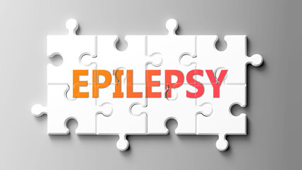 Epilepsy complex like a puzzle - pictured as word epilepsy on a puzzle pieces to show that epilepsy...