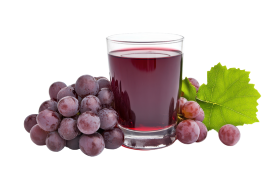 A refreshing glass of red grape juice surrounded by plump grapes and a vibrant green leaf