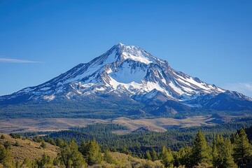 Fototapeta premium Majestic snow-capped mountain peak under a clear sky