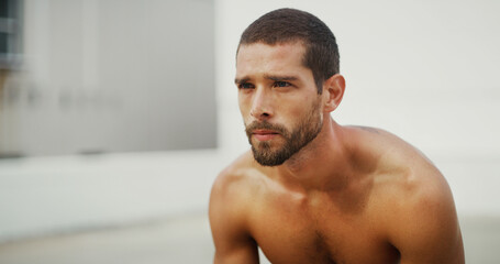 Obraz premium Breathing, outdoor and man with exercise, wellness and calm with rest, relax and challenge. Healthy person, athlete and guy in street, training or workout with runner, space and fitness with sports