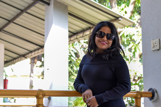 Indian female model in black dress posing for photo graph