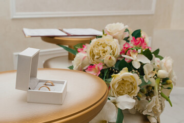 Wedding Rings In Box With Flowers Decoration
