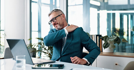 Hurt, mature man and shoulder pain in business, overworked and employee with discomfort of injury. Corporate, pressure and person with inflammation, laptop and accountant with muscle strain in office