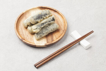  Kimmali is a dish made by wrapping vegetables or noodles in seaweed, coating them in batter, and...
