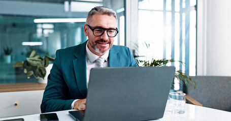 Mature, businessman and reading with laptop in office, financial report and auditing for corporate firm. Career, male person and accountant with tech for investment research, administration and smile