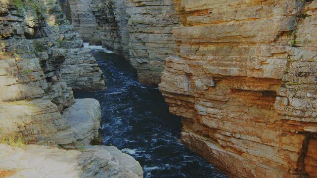 A breathtaking 4K video capturing the Ausable River flowing through the narrow gorge of Potsdam Sandstone in the Ausable Chasm, located within the blue line boundary of Adirondack Park, New York.