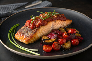 Grilled Salmon with Tomato Sauce and Roasted Vegetables.