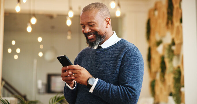 Happy, black man and chatting with phone for social media, communication or chat at hotel. Mature person, user or smile with mobile smartphone for online texting, check in or schedule list at resort
