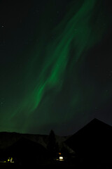 This captivating image captures the ethereal beauty of the aurora borealis illuminating the night...