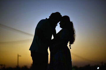 Romantic Maternity Silhouette Photography | Expecting Couple at Sunset | Heartwarming Pregnancy Moment Captured in Golden Hour | Parenthood & Love Story"