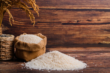 Natural Rice and Ear with Rustic Background on Wooden Surface