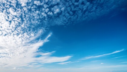 Obraz premium serene blue sky with white textured cirrus clouds peaceful cloudscape horizontal photo with copy space