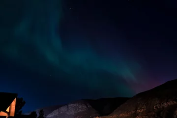 This breathtaking image depicts the aurora borealis dancing across a starry sky, showcasing the magical beauty of nature that inspires wonder and awe in its viewers.