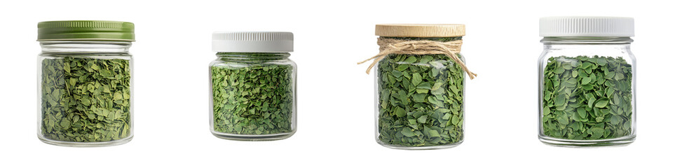 Multiple jars filled with dried crushed green herbs and spices displayed in a rustic kitchen setting showcasing a variety of culinary ingredients