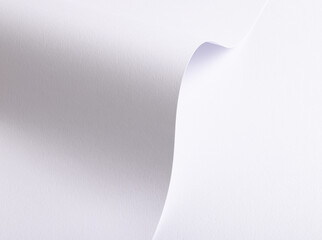 White paper background with a smooth texture and minimalistic design. A rich gradient effect with subtle light and shadow creates an elegant, abstract tone, perfect as a luxurious backdrop for.