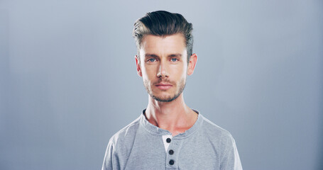Obraz premium Confident, serious and portrait of man, studio and graphic designer with ambition for career or freelancer. Mockup space, blue background and calm for web design in creative company, proud and USA
