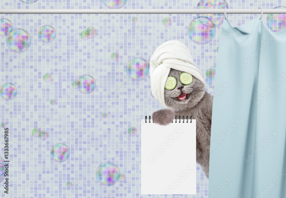 Fototapete laughing cat with towel on it head and with slices on it eyes peeking out from behind the curtain in