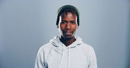 Black man, student and portrait in studio for development, education ambition and opportunity. University scholarship, ID card and person on gray background space for registration process and growth