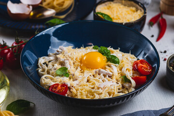 Pasta carbonara in a plate on the table