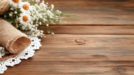 Fototapeta premium A Beautiful Arrangement of Wildflowers on Rustic Wooden Surface with Burlap and Lace Accents, Ideal for Home Decor or Crafting Projects