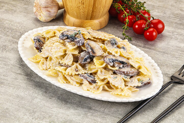 Italian cuisine - farfalle with mushrooms