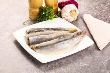 Marinated salted herring fillet apetizer