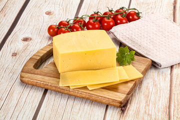 Yellow cheese piece with slices