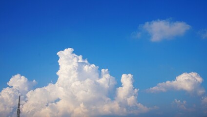 clear sky and puffy white clouds