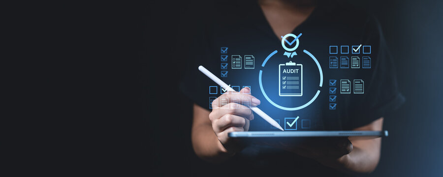 Digital audit concept with businessman using tablet and stylus.