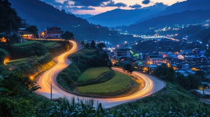 Fototapeta premium A scenic mountain road curves through a village at twilight