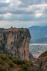 Meteora landscape with Monastery of the Holy Trinity on top of giant natural pillars, Kalabaka, Greece