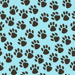 Obraz premium Cat tracks seamless pattern on blue background 