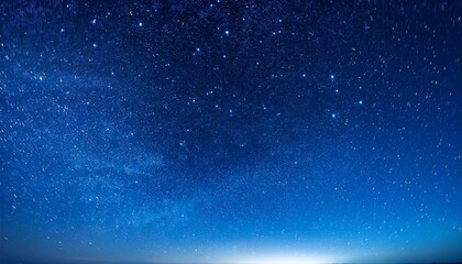 Obraz premium dark blue night sky and small twinkling stars abstraction minimalism there is no one in the photo astrology galaxy space background wallpaper texture