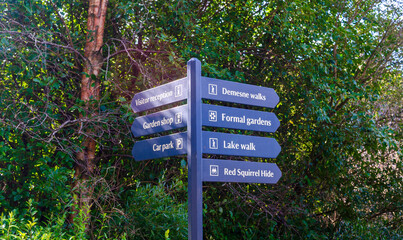 Directional sign on post in a country pointing to different attractions for walkers to visit