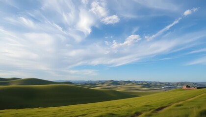 Serene landscape featuring a vast, open sky and rolling hills, farmland, outdoor
