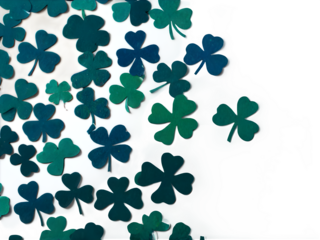 Scattered shamrock-shaped confetti pieces in various shades of green, spread across a bright white surface.
