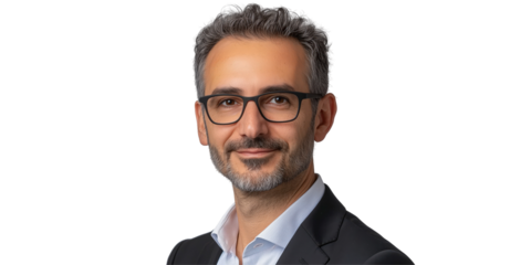 Portrait of a Focused Professional: A sophisticated man wearing glasses, exuding confidence, captured in a professional studio setting.
