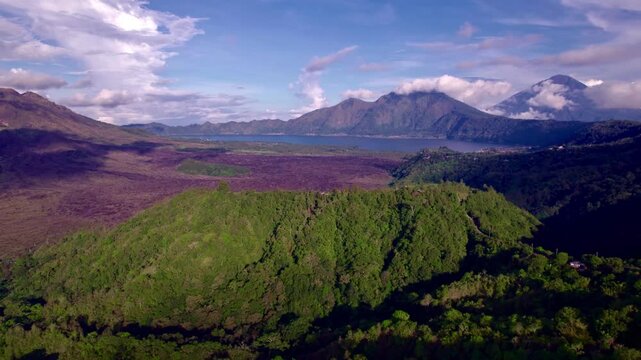 Aerial rising toward Batur Lake and Gunung Abang, Bali 
