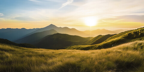 Golden sunset over rolling green hills and distant mountains
