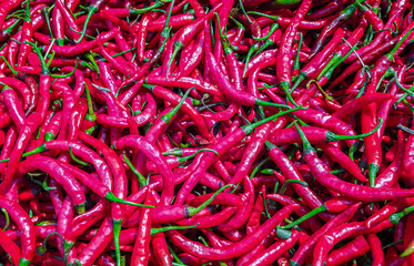 Beautiful red hot peppers on the table.