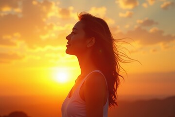Young woman enjoying a peaceful sunset, feeling relaxed and free with the warm glow of the sun on her face