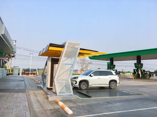 EVAT or Electric vehicle charging station installed beside the gas station in local area of Asian countries.
