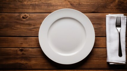 Elegant table setting mockup with a white plate and fork on rustic wood.