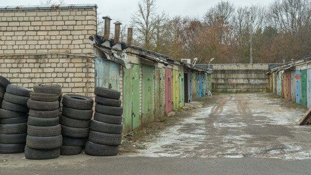 Storage of discarded old car tires outdoors, showcasing a pile of used tires ready for recycling. Highlighting environmental concerns and rubber waste management