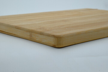 Wooden cutting board on white background