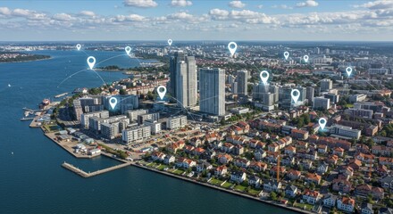 Obraz premium Aerial cityscape with digital pins and waterfront.